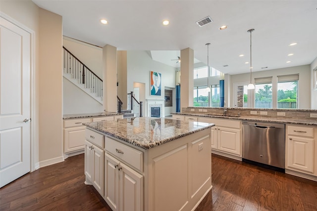 14062 Dunsmore Landing Dr, Houston, TX 77059 - kitchen featuring stainless steel dishwasher, a ceiling fan, dark wood-type flooring, light stone countertops, and recessed lighting