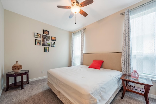 14062 Dunsmore Landing Dr, Houston, TX 77059 - carpeted bedroom with baseboards and ceiling fan