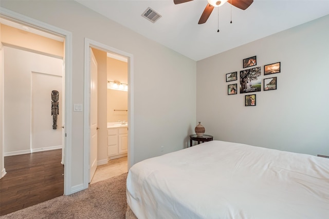 14062 Dunsmore Landing Dr, Houston, TX 77059 - bedroom with carpet, ensuite bath, and ceiling fan