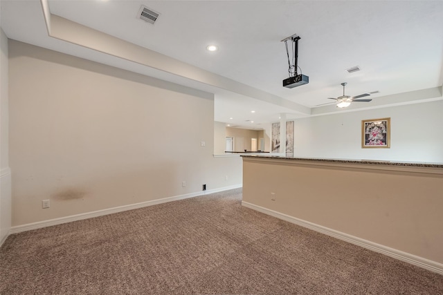 14062 Dunsmore Landing Dr, Houston, TX 77059 - empty room with light carpet, ceiling fan, a tray ceiling, and recessed lighting