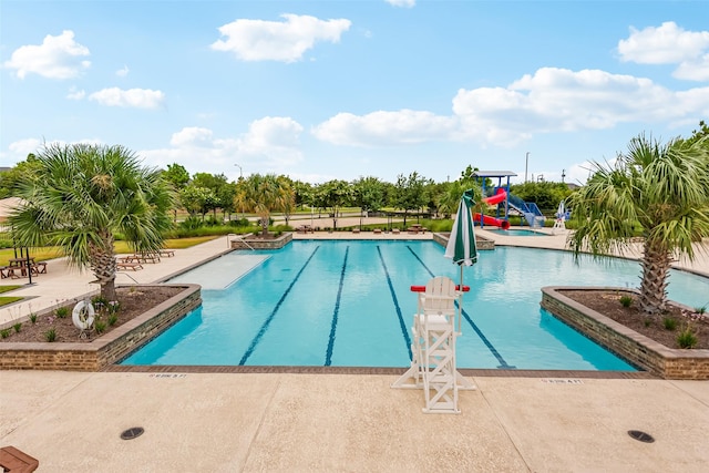 14062 Dunsmore Landing Dr, Houston, TX 77059 - community pool featuring a patio and a water slide