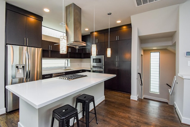 5638 Petty St Unit B, Houston, TX 77007 - kitchen featuring stainless steel appliances, island range hood, a kitchen breakfast bar, dark wood finished floors, and a kitchen island
