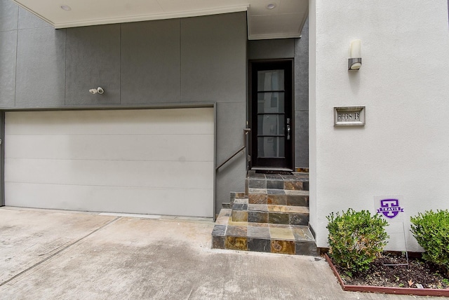 5638 Petty St Unit B, Houston, TX 77007 - property entrance with a garage and stucco siding