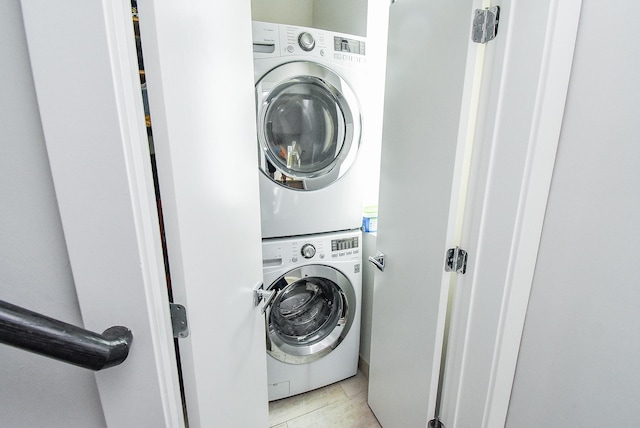 5638 Petty St Unit B, Houston, TX 77007 - laundry room with stacked washing machine and dryer and light tile patterned floors
