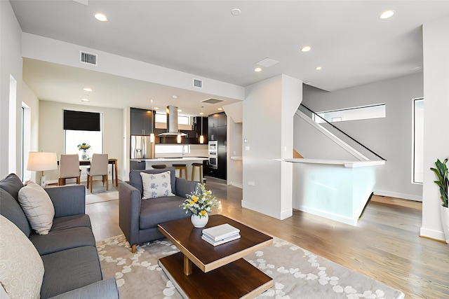 5638 Petty St Unit B, Houston, TX 77007 - living area featuring light wood-style floors and recessed lighting