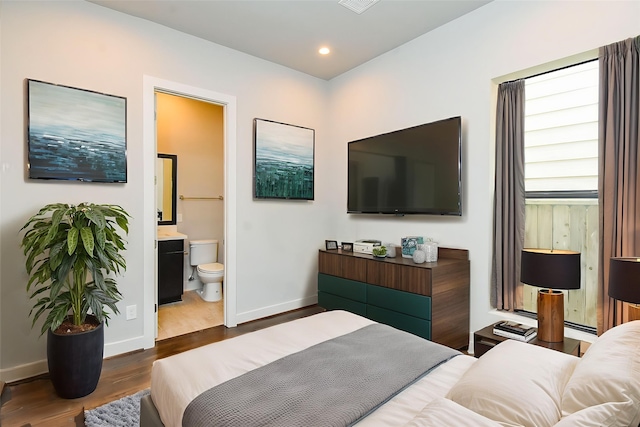 5638 Petty St Unit B, Houston, TX 77007 - bedroom with dark wood finished floors, ensuite bath, and recessed lighting
