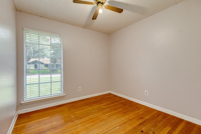 107 Sage St, Lake Jackson, TX 77566 - empty room featuring light wood-type flooring, a ceiling fan, healthy amount of natural light, and a textured ceiling