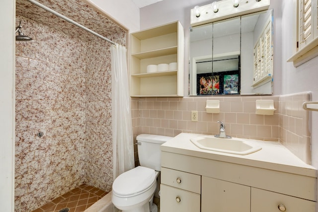 107 Sage St, Lake Jackson, TX 77566 - full bath with tile walls, a tile shower, vanity, and tile patterned flooring