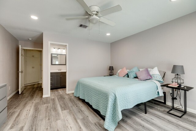 107 Sage St, Lake Jackson, TX 77566 - bedroom with light wood-style floors, recessed lighting, connected bathroom, and a ceiling fan