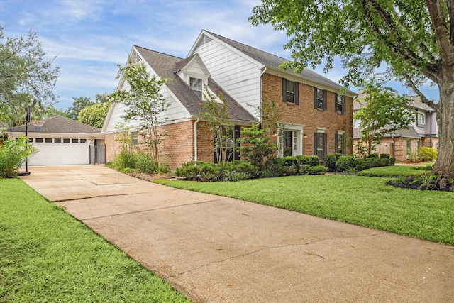 1643 Fall Valley Dr, Houston, TX 77077 - view of front of house with brick siding, concrete driveway, a front lawn, and a shingled roof