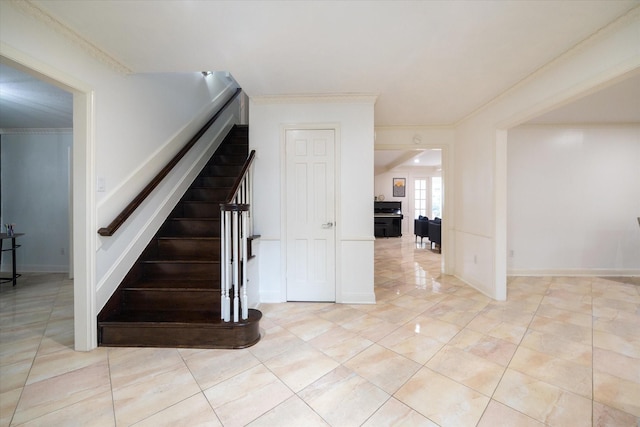 1643 Fall Valley Dr, Houston, TX 77077 - stairway with crown molding and tile patterned floors