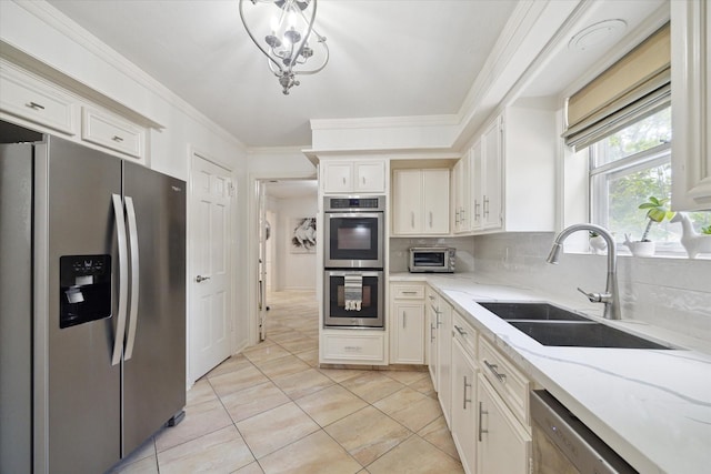 1643 Fall Valley Dr, Houston, TX 77077 - kitchen featuring appliances with stainless steel finishes, decorative backsplash, light stone countertops, white cabinetry, and light tile patterned floors