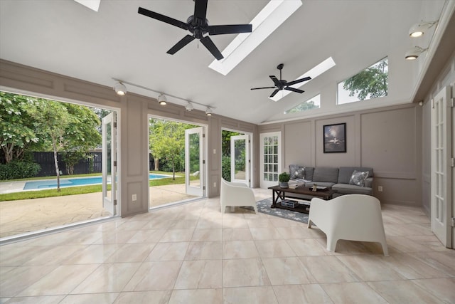 1643 Fall Valley Dr, Houston, TX 77077 - sunroom / solarium featuring a skylight, track lighting, and vaulted ceiling