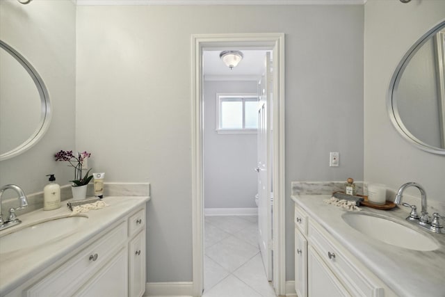 1643 Fall Valley Dr, Houston, TX 77077 - bathroom with two vanities, tile patterned flooring, and crown molding