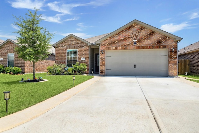 21022 Solstice Point Dr, Hockley, TX 77447 - single story home with brick siding, driveway, and an attached garage
