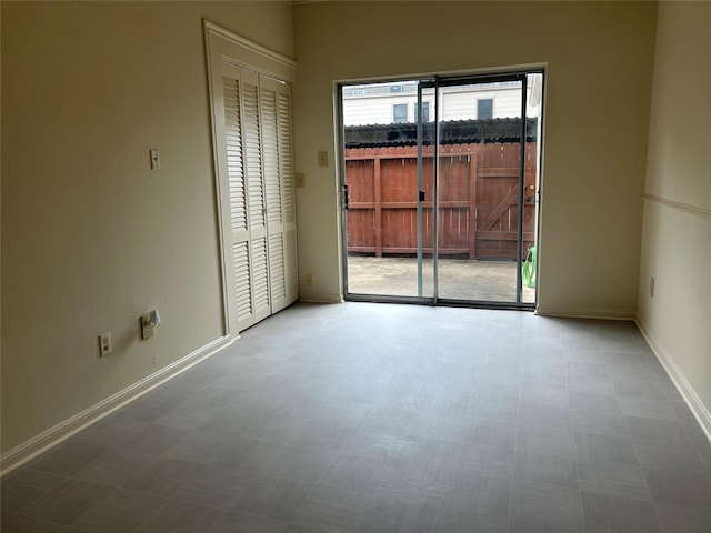 850 Threadneedle St Unit 71, Houston, TX 77079 - spare room with tile patterned floors and baseboards