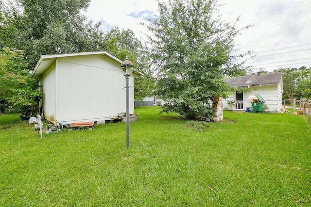 7111 Oak Village Dr, Houston, TX 77396 - view of green lawn with a shed