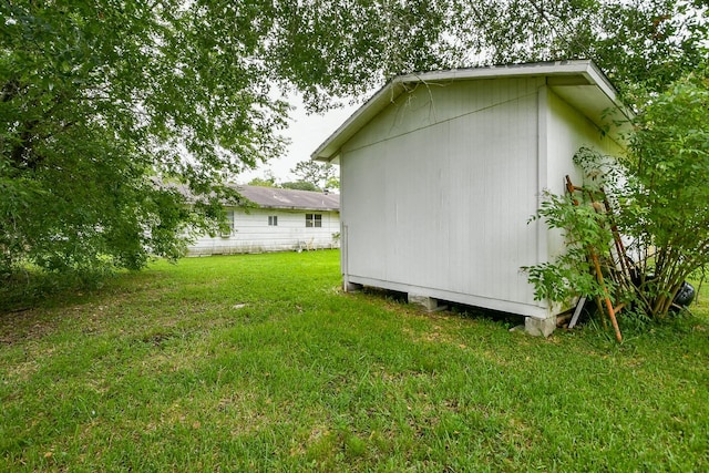 7111 Oak Village Dr, Houston, TX 77396 - view of property exterior featuring a lawn and a shed