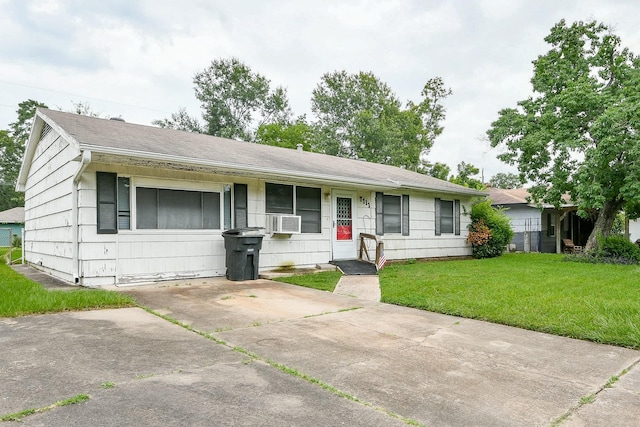 7111 Oak Village Dr, Houston, TX 77396 - ranch-style home featuring a front yard, cooling unit, and a shingled roof