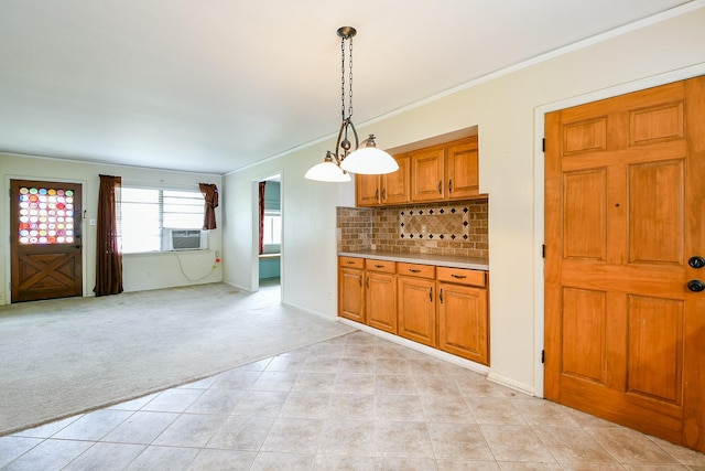 7111 Oak Village Dr, Houston, TX 77396 - kitchen with light carpet, ornamental molding, brown cabinetry, light countertops, and decorative backsplash