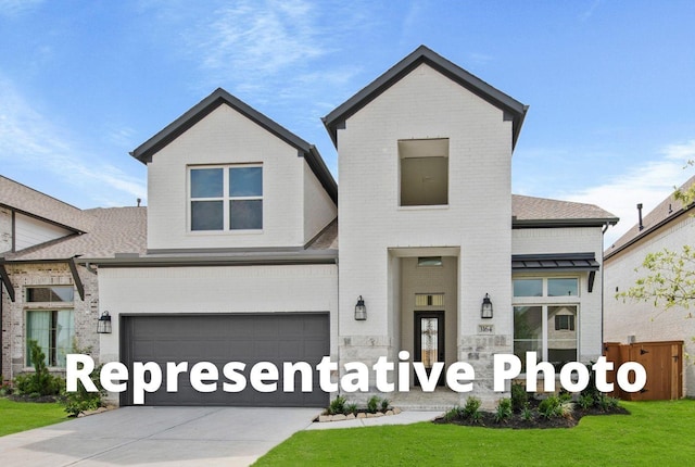 3173 Stingray Cove Dr, Katy, TX 77493 - view of front facade with brick siding, an attached garage, concrete driveway, a front yard, and a shingled roof