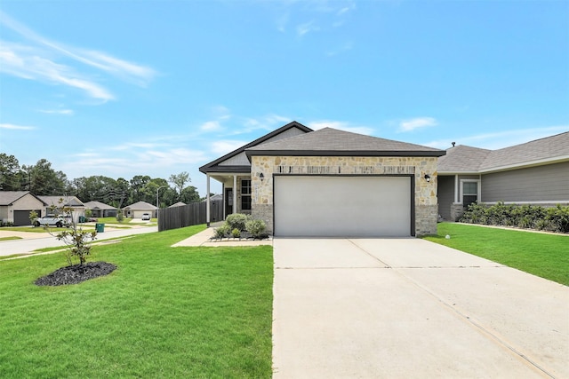 25707 Boxwood Hedge Ln, Tomball, TX 77375 - ranch-style home with an attached garage, driveway, and stone siding