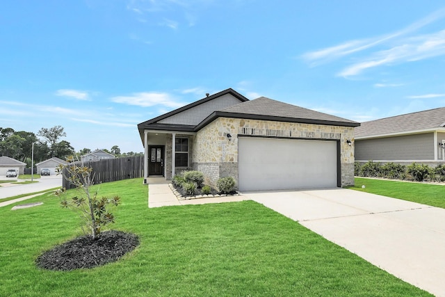25707 Boxwood Hedge Ln, Tomball, TX 77375 - view of front of home featuring a garage, concrete driveway, and stone siding