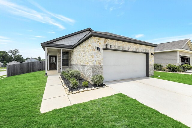 25707 Boxwood Hedge Ln, Tomball, TX 77375 - view of front facade with stone siding, a garage, and concrete driveway