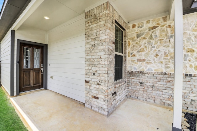 25707 Boxwood Hedge Ln, Tomball, TX 77375 - entrance to property with a porch and stone siding