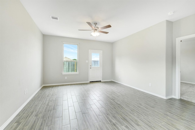 25707 Boxwood Hedge Ln, Tomball, TX 77375 - spare room with a ceiling fan, light wood-style floors, and a smoke detector
