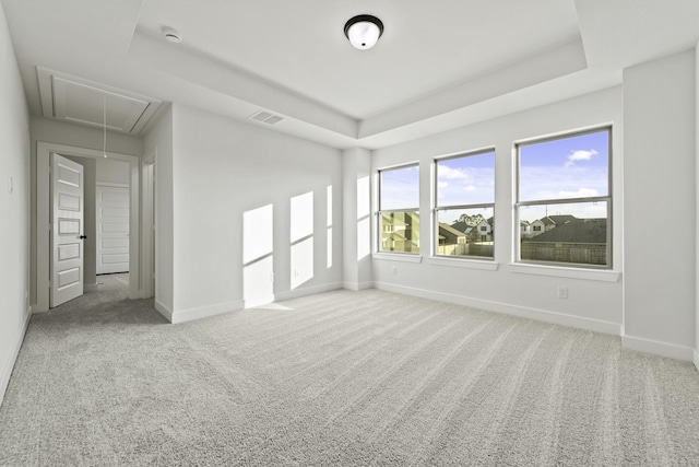 5021 Steady Breeze Dr, Katy, TX 77493 - carpeted empty room with attic access, a tray ceiling, and a smoke detector