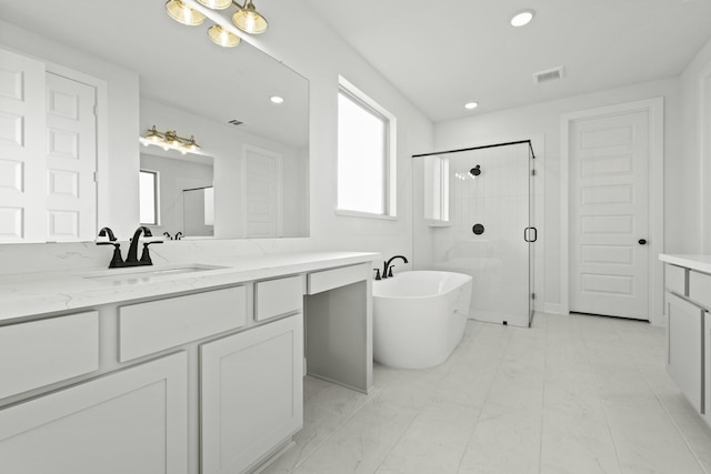 5021 Steady Breeze Dr, Katy, TX 77493 - full bath featuring vanity, a stall shower, a freestanding bath, plenty of natural light, and recessed lighting
