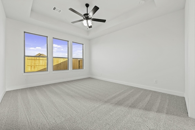 5021 Steady Breeze Dr, Katy, TX 77493 - empty room with a raised ceiling, carpet, and a ceiling fan