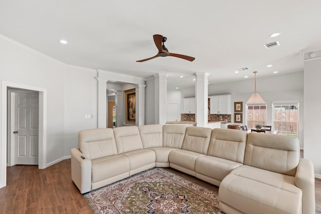 21403 Wild Jasmine Ln, Katy, TX 77450 - living area featuring decorative columns, ceiling fan, recessed lighting, wood finished floors, and crown molding
