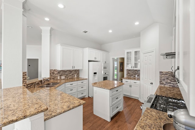 21403 Wild Jasmine Ln, Katy, TX 77450 - kitchen with white appliances, backsplash, white cabinetry, and recessed lighting