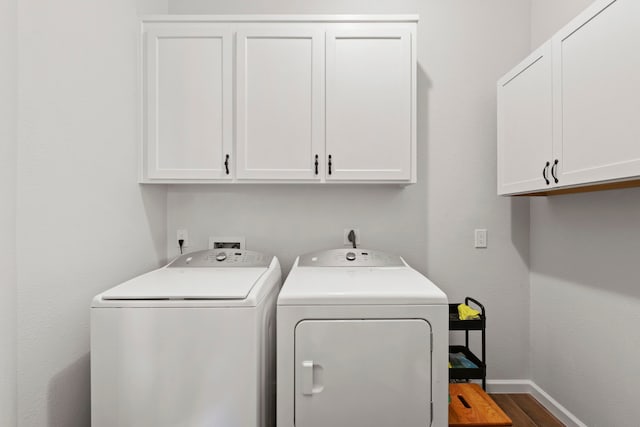 21403 Wild Jasmine Ln, Katy, TX 77450 - laundry area featuring cabinet space, washer and dryer, and wood finished floors