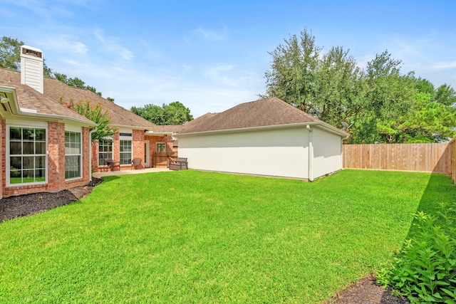 21403 Wild Jasmine Ln, Katy, TX 77450 - fenced backyard with a patio area