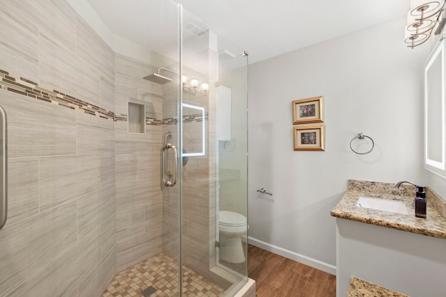 21403 Wild Jasmine Ln, Katy, TX 77450 - bathroom featuring vanity, a shower stall, and wood finished floors