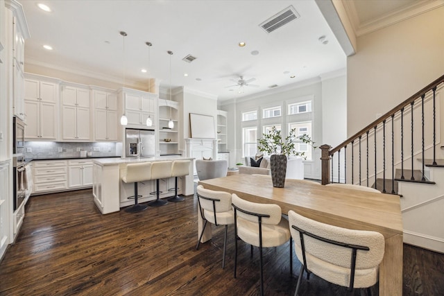 2108 Bidwell Dr, Houston, TX 77018 - dining area featuring ornamental molding, a ceiling fan, dark wood-style floors, stairway, and recessed lighting