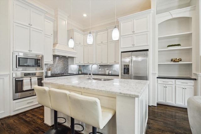 2108 Bidwell Dr, Houston, TX 77018 - kitchen with appliances with stainless steel finishes, dark wood-type flooring, pendant lighting, white cabinetry, and ornamental molding
