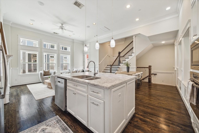 2108 Bidwell Dr, Houston, TX 77018 - kitchen with dishwasher, a decorative wall, ceiling fan, crown molding, and a wainscoted wall