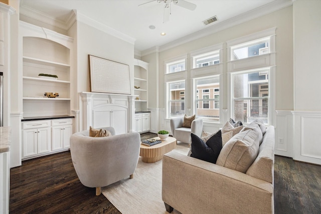 2108 Bidwell Dr, Houston, TX 77018 - living room with crown molding, built in features, dark wood finished floors, ceiling fan, and wainscoting
