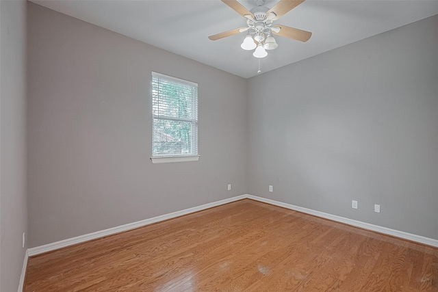 6210 Mahogany Way, Magnolia, TX 77354 - empty room featuring wood finished floors and a ceiling fan