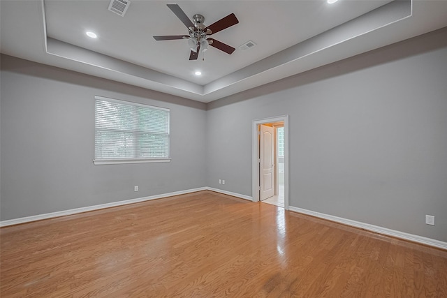 6210 Mahogany Way, Magnolia, TX 77354 - spare room with a ceiling fan, wood finished floors, recessed lighting, and a tray ceiling