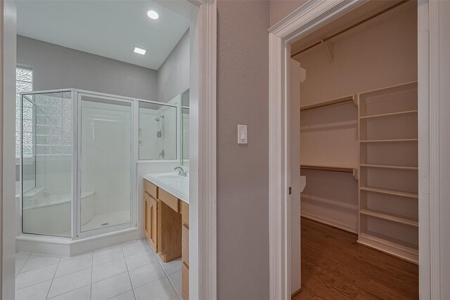 6210 Mahogany Way, Magnolia, TX 77354 - full bath with a stall shower, a spacious closet, vanity, and tile patterned flooring