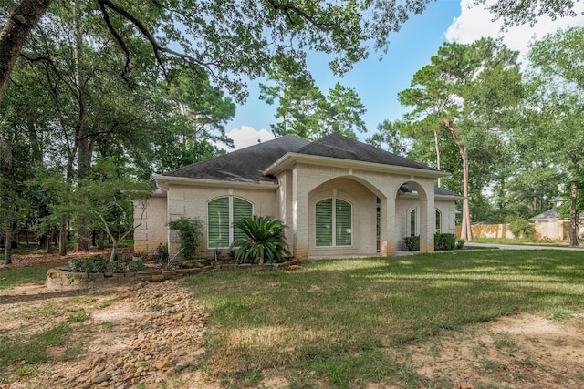 6210 Mahogany Way, Magnolia, TX 77354 - view of front facade featuring brick siding and a shingled roof