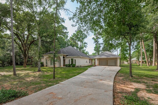 6210 Mahogany Way, Magnolia, TX 77354 - view of front of home featuring an attached garage and concrete driveway