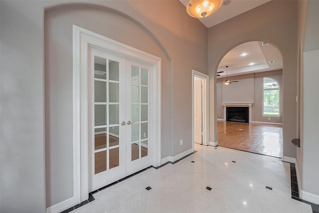 6210 Mahogany Way, Magnolia, TX 77354 - corridor featuring french doors, tile patterned floors, and arched walkways