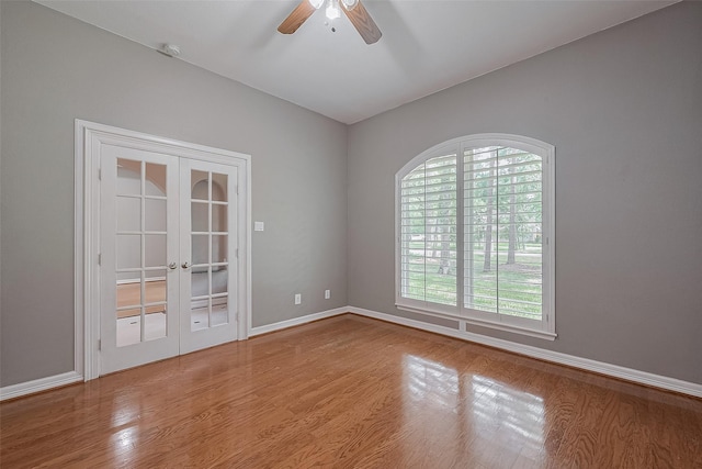 6210 Mahogany Way, Magnolia, TX 77354 - spare room with ceiling fan, wood finished floors, and french doors