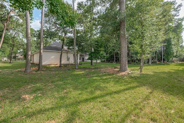 6210 Mahogany Way, Magnolia, TX 77354 - view of grassy yard with view of wooded area